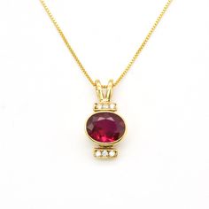 Gold Ruby Pendant set with a Created Ruby in a perfect diamond cut, flawless clarity & deep red color, at 10x8mm, 3 Cts.Gold Vermeil: 18k Gold over Solid 925 Sterling Silver ☞ made to last. Click here for ☞ Matching Ring Matching Earrings - please ask me Details:• Created Ruby in a flawless clarity & CZ Diamonds• Ruby: 10x8mm, 3 Ct, diamond cut• Pendant Height 21mm, Width 10mm• Free Complimentary Chain• 18k Gold VermeilSKU 2284 Classic Ruby Necklace In Yellow Gold, Classic Yellow Gold Ruby Necklace, Classic Ruby Necklaces For Formal Occasions, Formal Ruby Gemstones With Vvs Clarity, Elegant Red Diamond Gemstones, Elegant Gold Gemstones With Diamond Accents, Elegant Brilliant Cut Gemstones As A Gift, Timeless Red Gemstone Jewelry, Timeless Red Jewelry For Formal Occasions