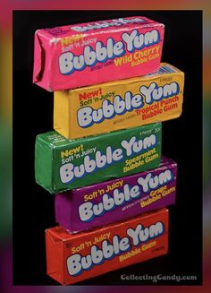 three boxes of bubble gum are stacked on top of each other in the same row