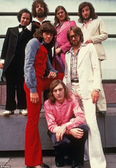 the bee gees are posing for a group photo