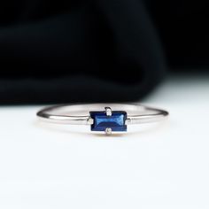 Product Details Celebrate your love and commitment with this beautiful Promise Ring. Adorned with a Baguette Cut Blue Sapphire set in a Four Prong Diagonal Setting, this ring is crafted in solid gold for a timeless and elegant look. The simple yet striking design of this Blue Sapphire Solitaire Ring makes it a perfect symbol of your promise to each other. Product Information SKU SHP-RINGS032218608 Width 1.5 mm Height 3.2 mm Weight 1.28 gm (Approximate) BLUE SAPPHIRE INFORMATION No.of Stones 1 Pi Luxury Minimalist Sapphire Solitaire Ring, Luxury Minimalist Sapphire Promise Ring, Luxury Minimalist Solitaire Sapphire Ring, Beautiful Promise Rings, Sapphire Solitaire Ring, Sapphire Solitaire, 18k Yellow Gold Ring, Signature Jewelry, Timeless Jewelry