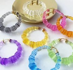 These round Crystal Clear Bamboo Hoops are made of translucent bamboo and lightweight acrylic material, making them eye-catching and easy to wear. Add a touch of natural elegance to your outfit with these stunning earrings.Available in 6 gorgeous colors! Bamboo Hoop Earrings, Personalized Accessories, Stunning Earrings, Oversized Silhouette, Earrings Collection, Acrylic Material, Holiday Collection, Tassel Earrings, Bridal Earrings