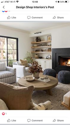 a living room filled with furniture and a fire place in the middle of the room