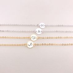 So pretty and delicate! Personalize the dainty disk with a hand stamped initial or meaningful symbol (heart). Layer this with other bracelets for the perfect look. Great gift idea for Bridesmaid, Birthday, and all meaningful days. This bracelet comes with an adjustable extender chain that has a tiny cute teardrop charm hanging at the end of the chain. ** Please be sure to LEAVE your desired initial at check out. Maximum 10 letters or numbers! ** Stamping Letter: 2.5 mm Script or Classic. (see th Personalized Simple Jewelry For Friendship, Simple Personalized Jewelry For Friendship, Personalized Dainty Name Bracelet, Dainty Adjustable Name Bracelet With Initials, Dainty Name Bracelet For Bridesmaid Gift, Minimalist Hand Stamped Name Bracelet For Friendship, Everyday Round Bracelets With Initials, Dainty Adjustable Bracelet With Initials, Dainty Hypoallergenic Name Bracelet For Friendship