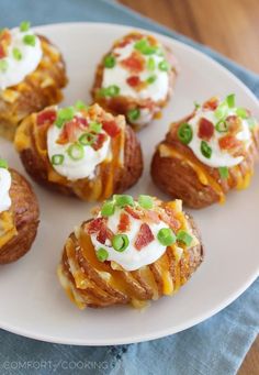 small appetizers with bacon, cheese and green onions on a white platter