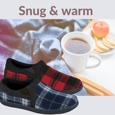 a pair of slippers sitting on top of a table next to a cup of coffee