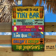 a sign that is on the side of a wooden fence saying tiki bar, it's always 5 o'clock here