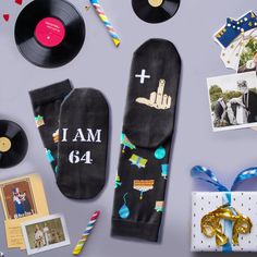 an assortment of personal items are laid out on a table, including socks and pictures