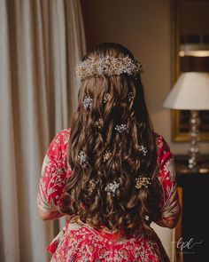 the back of a woman's head wearing a tiara