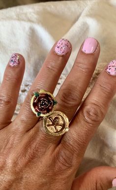 "Beautiful, unusual one of a kind ring, with a raised enamel rose, a hinged sliding cover under the relief rose, and an embossed skull with bones inside the secret compartment. The Rose cover stays in place by a hinge on one side, and an attaching small magnet on the other side. Abundant subtle details make this ring so unique and rare. The symbolisms leave vast room to the imagination. The sides are engraved with an ancient Celtic symbol. The ring is Solid Sterling Silver, (stamped .925) and Br Victorian Enamel Ring As A Gift, Victorian Enamel Ring As Gift, Victorian Enamel Ring For Gift, Unique Rose Design Jewelry Gift, Unique Rose Design Jewelry As Gift, Unique Rose Design Jewelry For Gifts, Die Rose, Celtic Symbol, Rose Skull