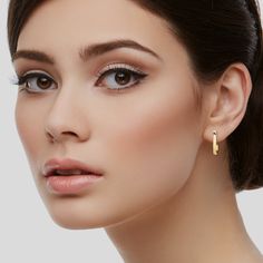 Crafted from exquisite 14K gold, these hoop earrings boast a luxurious radiance that adds a touch of sophistication to any ensemble. The elongated design offers a fresh and modern take on the traditional huggie hoop, making them a statement piece for those who appreciate a chic and updated look. ✪ MATERIAL • 14K Solid Gold (Stamped 14K for Purity Authenticity) • Offered in 14k Yellow, Rose, and White Gold • Available in 2 sizes: 20mm x 12.5mm 14mm x 10mm • 20mm Earrings Weight: 2.84 Grams • 14mm Luxury Tarnish Resistant Huggie Earrings, Elegant Yellow Gold Huggie Earrings, Fine Jewelry Huggie Earrings With Shiny Finish, Elegant Hypoallergenic Small Hoop Huggie Earrings, Elegant Shiny Finish Hoop Earrings, Elegant Polished Huggie Earrings, Elegant Huggie Hoop Earrings With Polished Finish, Rose Gold Fine Jewelry Huggie Earrings, Shiny Finish Huggie Earrings As Gift