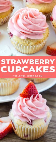 strawberry cupcakes with pink frosting and strawberries on top, sitting on a white plate