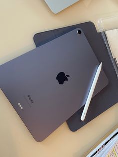 an apple ipad is sitting on top of a desk