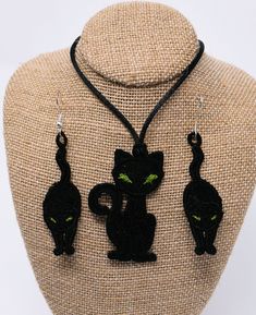 "These cute cat earrings and pendant are a \"must have\" to show off your wardrobe. These lacy items will dress up any outfit and are definitely appropriate for Halloween! The Pendant is 2\" long by 1.25\" wide and is fastened to a 24\" long polyester cord with a satin finish . You can tie it as long or short as you wish (just make sure to make a tight knot). The earrings are 2\" long by .75\" wide and are fastened to hooks made of stainless steel. These would be a great addition to your Hallowe Party Jewelry With Cat Design And Cat Ears, Party Jewelry With Cat Design, Goth Things, Cat Pendant, Cat Pendants, Santa Ornaments, Star Ornament, Cat Earrings, Stainless Steel Earrings