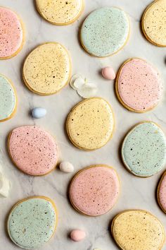 some cookies with different colors and shapes on a table