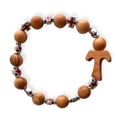 This stretch bracelet features ten beads, each meticulously handcrafted from wood, providing a natural and rustic feel. The centerpiece of this unique piece is the Tau Cross, a symbol of faith and protection. Interspersed among the wooden beads are  red Celtic crosses , adding a touch of color and further spiritual symbolism to the bracelet.    
   This bracelet is not only a statement of faith but also a piece of art that showcases the skill of the craftsmen who made it. It's a perfect access Red Wooden Beads Bracelets As Gift, Spiritual Red Beaded Bracelets With Wooden Beads, Red Wooden Round Bead Bracelets, Red Wooden Round Beads Bracelet, Red Wooden Bead Bracelets, Tau Cross, Celtic Crosses, Italy Jewelry, Wooden Bracelet