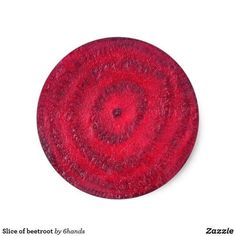 a close up of a red object on a white background with the words, slice of beetroot by amanda