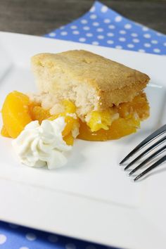 a piece of cake and whipped cream on a plate