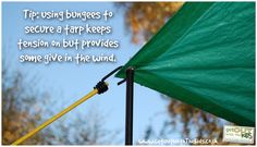 a green umbrella with the words tip using bungees to secure a tarp keeps tension but provides some give in the wind