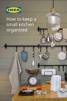 a kitchen counter with various items hanging on the wall