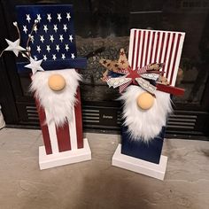 two christmas decorations made to look like santas with american flags and stars on them