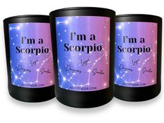 three candles with the words i'm a scorpio written on them in purple