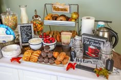 a table topped with lots of different types of food and drinks on top of it