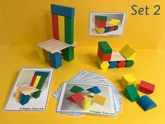 an assortment of colorful wooden toys sitting on top of a yellow table