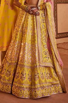 Yellow silk can can attached bridal lehenga featuring sequins and beads embellished floral stripe and geometric motifs. Comes with padded embellished blouse and dupatta. - Aza Fashions Yellow Wedding Gown With Intricate Embroidery, Wedding Sets With Motifs, Wedding Lehenga With Motifs, Yellow Wedding Choli With Motifs, Wedding Yellow Choli With Motifs, Sequin Lehenga, Cape Lehenga, Lehenga And Blouse, Kurta Lehenga