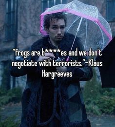 a man holding an umbrella with the caption frogs are less and we don't negotiate