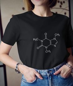 Hello, Welcome to My Store! The T-shirt with 'Caffeine Formula' Printed by Printing Machine with High Quality and There is 2 Different Color Options for Your Choice. The Print Material is Very Durable for Washing with Machine or Hand Wash.  The T-Shirt Material is 100% Cotton. If you have any question, please leave a message. Coffee Color Crew Neck Top, Caffeine Formula, Black And White Tshirt, Womens Graphic Tees, Printing Machine, Printed Materials, Graphic Tees Women, 2 Colours, White Tshirt