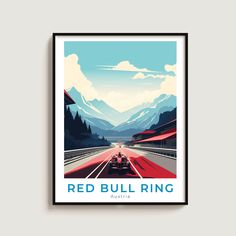 a red bull ring poster hangs on the wall above a road with mountains in the background