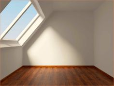 an empty room with wooden floor and skylight in the corner, 3d rendering image