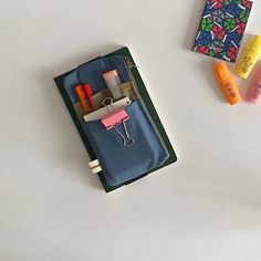 "Planner pouch with elastic band. Planner Pen Pouch is great for A5 Planners, notebooks, journals, and agendas. Check out a set of different sized pen pouches to store all your stationary in my shop.   🎁 WHAT IS IN THE PACKAGE * 1 piece  Planner pencil pouch with multi pocket Take a look at my journal pen pouch collection ⬇ https://etsy.me/3WQgwDp Take a look at my pen holder bag collection ⬇ https://etsy.me/3Kd6ZBV Take a look at my canvas planner cover/ a5 notebook pouch collection ⬇ https://etsy.me/3MFaLXC In summary; EXTERIOR BODY *  Cotton canvas fabric. *  3 pockets *  1 large pocket *  elastic band *  with zipper INNER *  100% cotton lining 📐 SIZE  Pencil case for a5 notebook; * Width: 10 cm / 3,93\" inc * Length:  20 cm / 7,87 \" inc Elastic for A5 planners; *21 cm / 8.3\" inc If Back To School Zipper Pouch Stationery For Organization, Zipper Pouch Organizer For Back To School, Back To School Stationery Zipper Pouch For Daily Use, Blue Pencil Organizers For School, Back To School Stationery With Zipper Pouch, Blue Stationery Pen Holders For Study, Blue Stationery For Back To School Organization, Blue School Organizer With Pen Slots, Blue School Organizers With Pen Slots