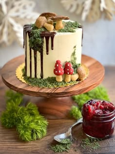 there is a cake with mushrooms on it and some cranberry sauce next to it