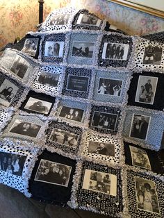 a black and white photo quilt on top of a bed