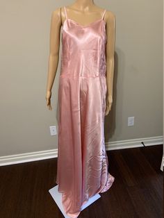 This is a luscious satin slip dress from the 1930s in a most flattering deep pink hue. In addition to its unique color, this gown is very large. I have pinned it a bit so that it didn't slide off my size 2 mannequin. It would definitely look great on a very voluptuous figure or the seams could be taken in to fit a rather large range of smaller sizes. In any case, it is in outstanding condition, with no holes, tears, or major stains. Fantastic! Approximate measurements: Bust: 49 inches Waist: 42 Vintage Satin Slip Dress For Evening, Pink Silk Slip Dress For Prom, Pink Silk Prom Slip Dress, Vintage Satin Evening Gown, Vintage Satin Gown For Evening, Pink Silk Slip Dress With Bias Cut, Pink Silk Slip Dress For Wedding, Solid Silk Bias-cut Maxi Dress, Solid Silk Bias Cut Maxi Dress