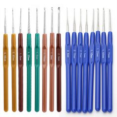 six different colored crochet hooks and needles