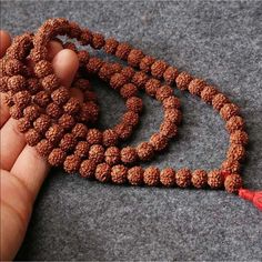 These 108 Rudraksha Seeds Are Associated With The Hindu Deity Shiva And Are Commonly Worn For Protection And For Chanting Mantras, Such As ‘Om Nanak Shivaya’. Valued Similarly To Semi Precious Stones, Believed To Have Medicinal And Magical Properties. Each Bead Capable Of Aligning Our Mind And The Energy Around Us To Support Health, Happiness, Prosperity, Harmony And A Fearless Life. Spiritual, Healing, Yoga, Yogi, Meditation, Mala, Brown Bohemian Mala For Puja, Bohemian Brown Mala For Festivals, Meditation Prayer, Hindu Deities, Mens Accessories Jewelry, Prayer Beads, Mala Beads, Tan Brown, Buddhism