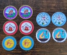 six stickers depicting different types of fire fighters on a wooden table with wood grain