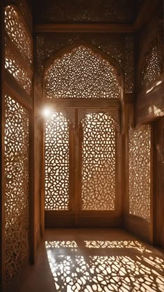 an intricate wooden room with sunlight shining through the window and shadows on the wall behind it