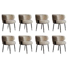 six chairs with sheepskin upholstered back and legs, all in different sizes