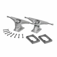 two silver skateboard trucks with hardware and screws