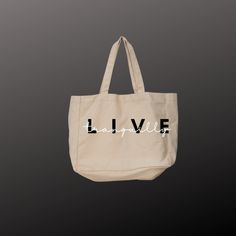 "LIVE Tranquilly and Sustainably! The cotton canvas tote bag is the ideal grab & go accessory - especially for last-minute shopping trips. Made of 100% cotton, this tote fits right in with any style.  Regular Tote: 6 oz., Cotton Canvas Basic flat tote 22 cotton canvas handles 14.5 x 15.5 Non-branded label/tag Large Tote: Self-fabric handles. Interior zippered pocket. 22\"W x 16\"H x 6\"D   24\" Handles Imprint: 8\"W x 6\"H CARE INSTRUCTIONS: Before cleaning the bag, remove all the items from the Large Everyday Canvas Gift Bag, Everyday Large Capacity Cotton Bag, Large Capacity Cotton Bag For Everyday Use, Large Capacity Cotton Canvas Shopping Bag, Large Cotton Canvas Bag For Everyday, Large Cotton Everyday Bags, Everyday Cotton Canvas Tote Bag, Large Cotton Shopping Bag, Everyday Canvas Bag With Letter Print