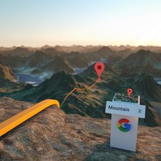 a mountain with google maps on it and some markers in the ground next to it