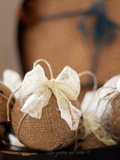 some burlap bags with white bows on them