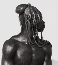 a man with dreadlocks on his back