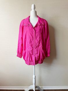 ~* ALL ITEMS ARE UNIQUE VINTAGE PIECES *~ ITEM DESCRIPTION: How freakin' cool is this vintage 80s/90s hot pink windbreaker jacket?! Perfect for the upcoming fall/winter season. Material is 100% Nylon, and it features deep pockets, small shoulder pads, and snap buttons. Garment has been gently worn and is still in great condition.  SIZE: Medium/Large MEASUREMENTS: (All measurements are taken while the garment is laying flat. Please note that vintage sizing is not the same as modern day sizing and Retro Long Sleeve Windbreaker For Spring, Vintage Oversized Outerwear For Summer, Pink Summer Outerwear With Button Closure, Retro Windbreaker With Pockets For Spring, 90s Style Windbreaker With Pockets For Spring, Retro Spring Windbreaker With Pockets, Retro Pink Windbreaker For Fall, 90s Style Pink Long Sleeve Outerwear, 90s Style Pink Windbreaker For Spring