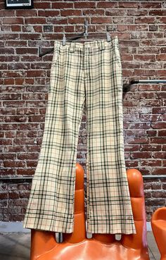 Mens 70s Ultra Mod Plaid Pants with a Subtle Flare Mens seventies ultra mod plaid pants cut with a subtle flare at the hem. The plaid is beautiful! Forrest green and brick red against an ivory background. Talon zipper fly with a hook and bar closure at the waist. Front and back pockets. Fantastic belt loops. The fabric is a light weight permanent Prest. No stretch. The tag says Forever Prest. Amazing on a thin, tall guy. Faint spots throughout. Not really noticeable while wearing. A name written on the inside of the waist as they often did in the seventies. See photogrid and photo. Please do not purchase if this bothers you.  By Hagger Slacks Measurements:  31.25" waist 39" hip-hip measurement is key. If they do not go over your hips they will not fit 32.5" inseam 10.5" rise 20.5" flare ci Men Flare Pants, Ivory Background, Hip Hip, Plaid Pants, Brick Red, Tall Guys, Wool Plaid, Mens Trousers, Flare Pants