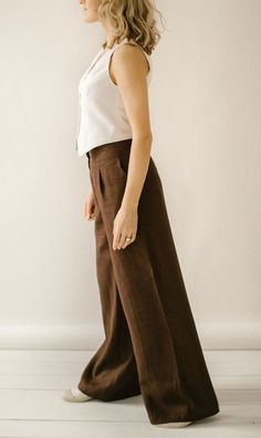 "ETHICALLY MADE. Every linen Palazzo pants is handmade using the body measurements of the individual customer. No factory use. Every creative and sewing task is fairly rewarded. Color in the picture- chocolate. Other colors are available. DESCRIPTION: Linen Pants: -Wide leg -Two front pockets -Two back pockets -Wide waist line -Zipper -Handcrafted Material: 100 % softened Lithuanian linen, medium weight, 205 g/m2. Fabric of this linen Palazzo pants IS WASHED BEFORE SEWING. Therefore you do not n Brown Linen Trousers Outfit, Brown Pants With Belt Loops And Loose Fit, Linen Bottoms With Belt Loops, Brown Wide Leg Linen Pants, Brown Linen Workwear Bottoms, Brown Linen Wide Leg Bottoms, Brown Linen Wide Leg Pants, Brown Linen Bottoms For Work, Brown Linen Pants For Work