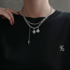 Unisex Gothic punk dark style to elevate your fashion vibes! Double layering silver chain necklace choker with crystal north star charm, cross drop pendant, and silver donut ring charm. Very chic and stylish for men and women, an eye-catching posh necklace to show your unique edgy taste. 💎 Features: ♥ Handcrafted ♥ Finish Tone: silver ♥ Side Stone: cubic zirconia ♥ Double layer, Adjustable closure ♥ Approximate Measurements: - Length: 18" with 2.5" adjustable ♥ Nickel/Lead Free, Hypoallergenic, Silver Star-shaped Alloy Jewelry, Silver Metal Chain Necklace With Star Charm, Edgy Silver Alloy Necklace, Edgy Silver Alloy Jewelry, Trendy Streetwear Silver Chain Jewelry, Punk Style Silver Clavicle Chain Jewelry, Silver Punk Clavicle Chain Jewelry, Punk Style Clavicle Chain Necklace With Cross, Punk Style Cross Clavicle Chain Necklace